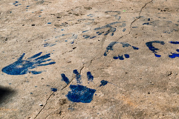 Blue handprints on the floor