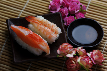 The seafood sushi serving with soy sauce and wasabi