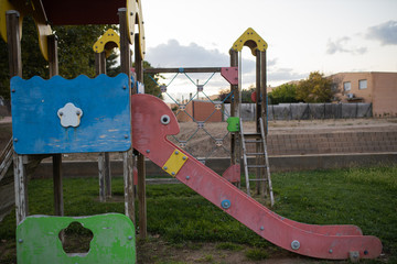 Green area with children's playground with slides