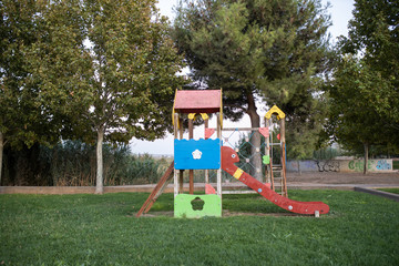 Green area with children's playground with slides