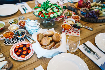 Brushettas, Cheese Varieties, Mediterranean Olives, Pickles, Bowl of Prosciutto di Parma and jams
