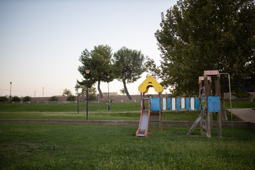 Obraz na płótnie Canvas Green area with children's playground with slides