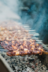 barbecued shish kebab. Preparation of shish kebab bbq. Grilled meat shish kebab