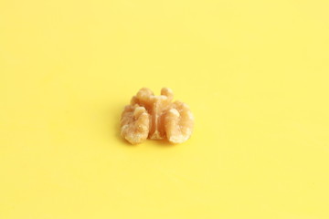 Peeled walnuts in colorful background