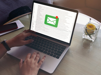 Business woman's hands are using Laptop Computer with E-Mail Communication Connection Message Online Chat Social Text Global Letters , business concept, Laptop mockup with clipping path on screen.