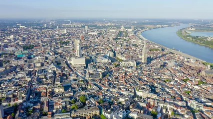 Fototapeten Antwerpen, Belgien. Fliegen über die Dächer der historischen Stadt. Fluss Schelde (Esco), Luftbild © nikitamaykov