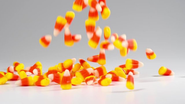 Time for Halloween. Delicious candy corn falls in slow motion.