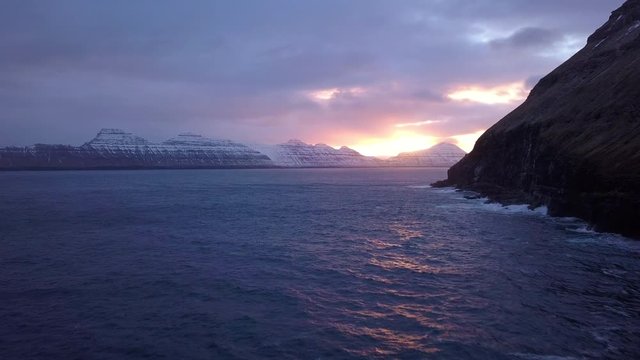 Sunrise over snowy mountains, Gjogv, Eysturoy island, Faroe Islands, Denmark