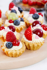 Colorful cupcakes with fresh fruits.