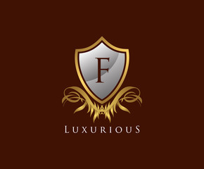 Obraz premium Classy Shield F Letter Logo. Gold Vintage Shield With F Letter prefect for boutique, hotel, restaurant, wedding and other elegant business. 