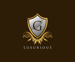 Obraz premium Classy Shield G Letter Logo. Gold Vintage Shield With G Letter prefect for boutique, hotel, restaurant, wedding and other elegant business. 
