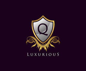 Classy Shield Q Letter Logo. Gold Vintage Shield With Q Letter prefect for boutique, hotel, restaurant, wedding and other elegant business. 