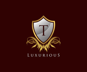 Classy Shield T Letter Logo. Gold Vintage Shield With T Letter prefect for boutique, hotel, restaurant, wedding and other elegant business. 