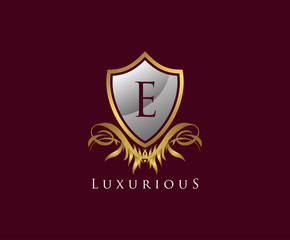Classy Shield E Letter Logo. Gold Vintage Shield With E Letter prefect for boutique, hotel, restaurant, wedding and other elegant business. 