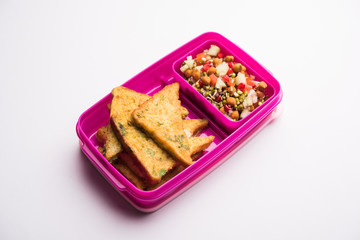 Lunch Box / Tiffin for Indian kids, includes bread Omelette pakora with tomato ketchup or sprouts, selective focus
