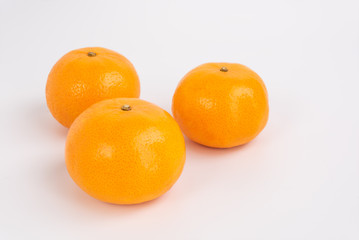 Fresh orange fruits on white background