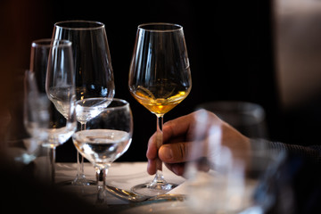 Glass of white, rose and red wine seen from close up.
