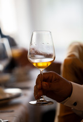 Glass of white, rose and red wine seen from close up.