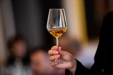 Glass of white, rose and red wine seen from close up.
