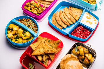 group of Lunch Box / Tiffin for Indian kids, showing variety or multiple option or combination of healthy food for your school going children