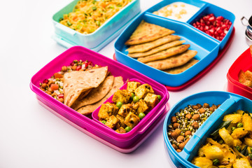 group of Lunch Box / Tiffin for Indian kids, showing variety or multiple option or combination of healthy food for your school going children
