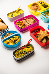 group of Lunch Box / Tiffin for Indian kids, showing variety or multiple option or combination of healthy food for your school going children