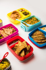 group of Lunch Box / Tiffin for Indian kids, showing variety or multiple option or combination of healthy food for your school going children