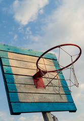 old basketball hoop with an empty basket