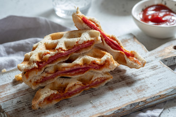 pizza waffle with ham, pepperoni and cheese
