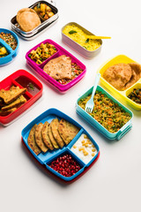 group of Lunch Box / Tiffin for Indian kids, showing variety or multiple option or combination of healthy food for your school going children