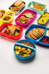 group of Lunch Box / Tiffin for Indian kids, showing variety or multiple option or combination of healthy food for your school going children