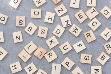 Alphabet letters on grey background.