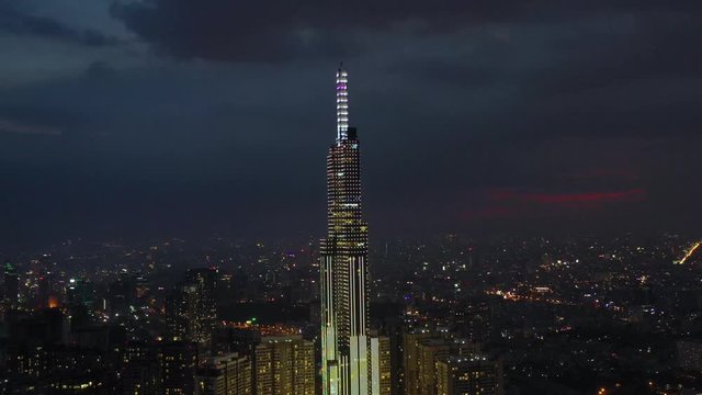 Top View of Building in a City - Aerial view Skyscrapers flying by drone of Ho Chi Mi City on sunset with building , transportation, energy power 
