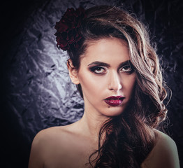 glamorous young woman with bright evening make-up