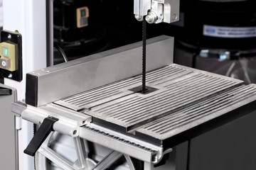 Modern woodworking machine with continuous band saw.