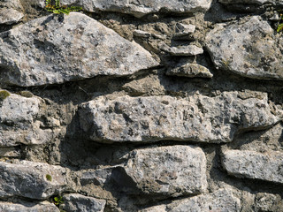 Stone wall texture close up, Grey color.