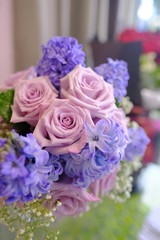 Macro view of colorful blue red green white pink purple rose flower bouquet in full blossom
