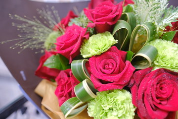 Macro view of colorful blue red green white pink purple rose flower bouquet in full blossom
