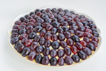 The legendary Tiffany layered salad with grapes, chicken and cheese on the white background.