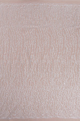 Texture lace fabric. lace on white background studio. thin fabric made of yarn or thread. a background image of ivory-colored lace cloth. White lace on beige background.