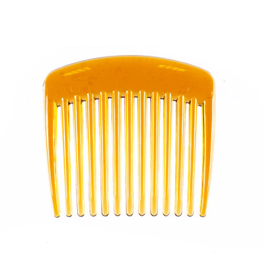 Wide Tooth yellow plastic Comb,close up isolated white background