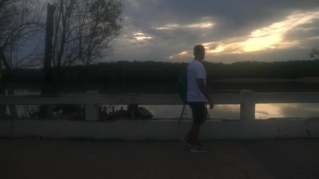 Man walking around at the harbor in Thailand. (Slow Motion - Angle 003)