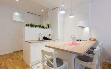 Interior of a open plan apartment, living room, kitchen, dining area