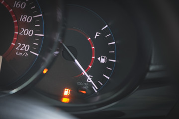 Low Fuel gauge showing fuel dashboard.