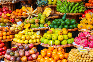 Tropical fruits on the famous market in Funchal, Madeira Island, Portugal. Exotic fruit. Banana, mango, passion fruit or avocado. Colorful food, healthy lifestyle