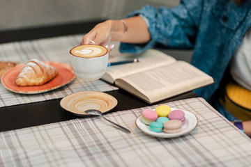 girl at a business breakfast with a croissant