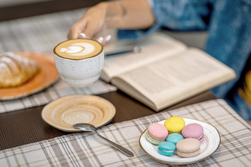 girl at a business breakfast with a croissant