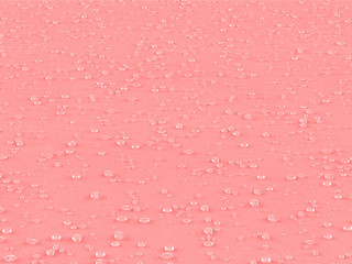 Water Droplet On Pink Textured Surface