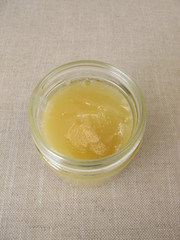 A jar of with light yellow linden flowers honey 