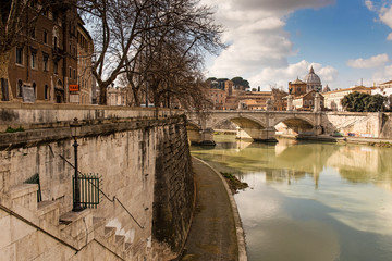 Obraz premium Rome, Italy, February 20, 2017 - view of Rome, Italy. Tiber River with bridges in Rome. Beautiful scenic panorama of Rome city.